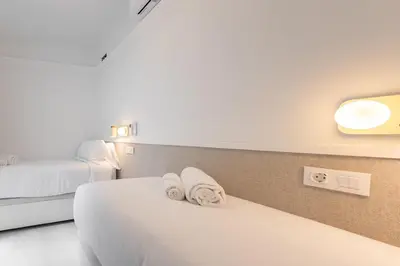 Cama o camas de una habitación en ISG Apartments Family Stay San Marcos