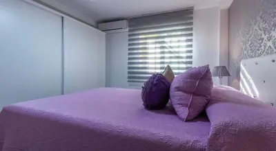 Cama o camas de una habitación en La Magia del Rosa