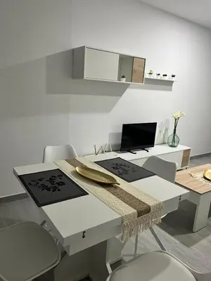 Una televisión o centro de entretenimiento en Apartamento El Rincón del Olivar III