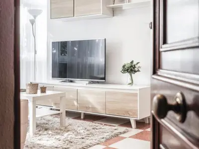 Una televisión o centro de entretenimiento en Apt 3 habitaciones cerca Histórico Sevilla 4px