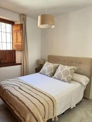 Cama o camas de una habitación en Duplex en plena Juderia