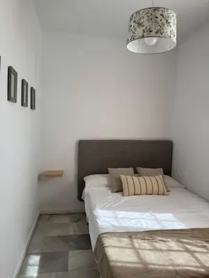 Cama o camas de una habitación en Duplex en plena Juderia