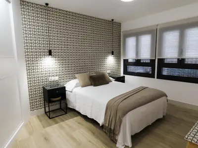 Cama o camas de una habitación en Apartamentos Casa Miguel