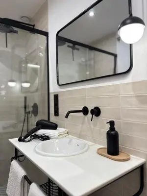 Un baño de Apartamentos Casa Miguel