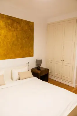 Cama o camas de una habitación en GoToSeville Talavera Suites
