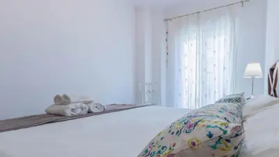 Cama o camas de una habitación en Vive Córdoba Apartamento junto a Estación y Centro