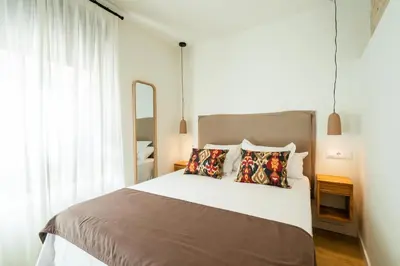 Cama o camas de una habitación en Los Patios de Feria - Flamenco