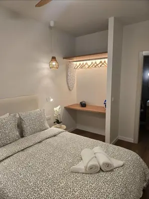 Cama o camas de una habitación en LHOME Puerta Osario Centro