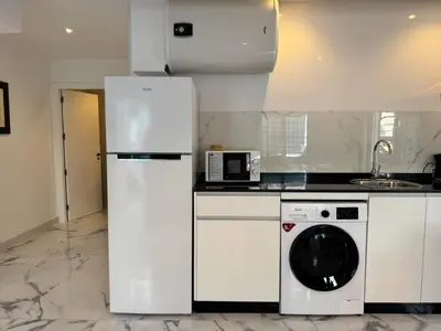 Una cocina o zona de cocina en Apartamento Reina Centro Suite