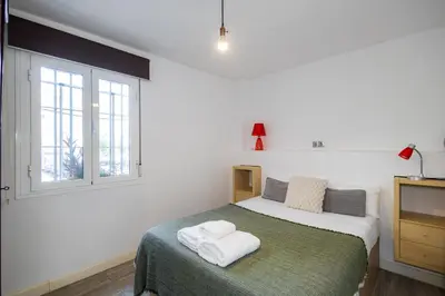 Cama o camas de una habitación en Acogedor Piso de 2 Dormitorios en Sevilla