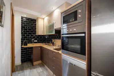 Una cocina o zona de cocina en Acogedor Piso de 2 Dormitorios en Sevilla