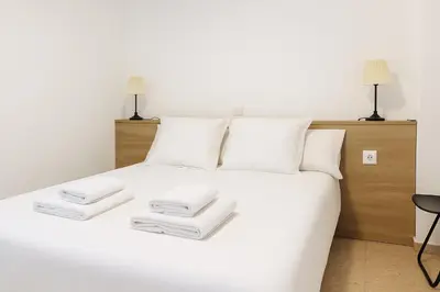 Cama o camas de una habitación en RentalSevilla Hiniesta