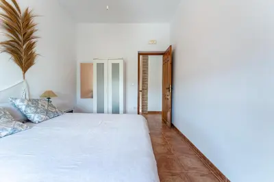 Cama o camas de una habitación en MalagaSuite Cortijo Segura