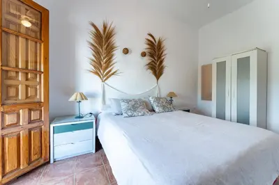 Cama o camas de una habitación en MalagaSuite Cortijo Segura