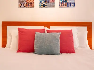 Cama o camas de una habitación en 1 Dorm Elegante en la Sevilla más autentica