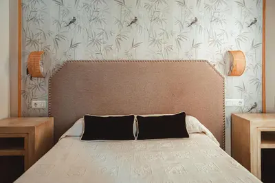 Cama o camas de una habitación en Hostal Boutique El Rey del Sol