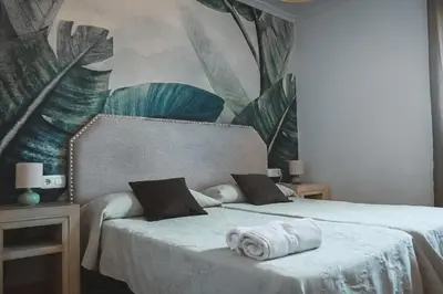 Cama o camas de una habitación en Hostal Boutique El Rey del Sol