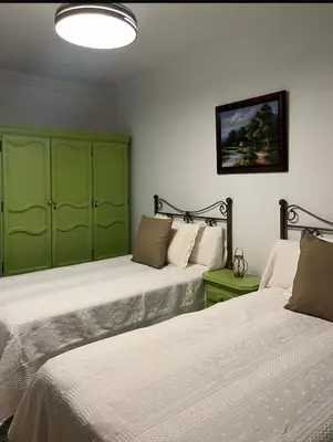 Cama o camas de una habitación en Casa amplia a un paso de Sevilla