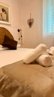 Cama o camas de una habitación en Alojamiento turístico Puerta del Puente Romano
