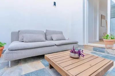 Zona de estar de Deanes Califa Suites 5