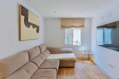 Zona de estar de Deanes Califa Suites 5