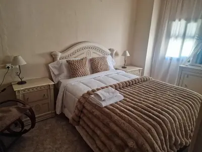 Cama o camas de una habitación en La Atalaya del Bailón