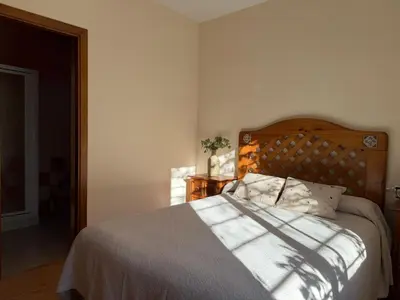 Cama o camas de una habitación en La Retama de la Encantada