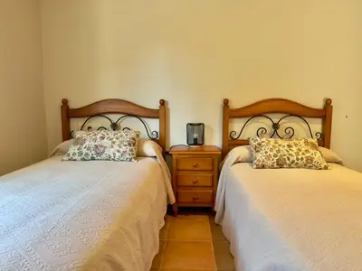 Cama o camas de una habitación en La Retama de la Encantada