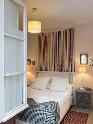 Cama o camas de una habitación en Lirio de Sevilla Apartment with a pool in the old town