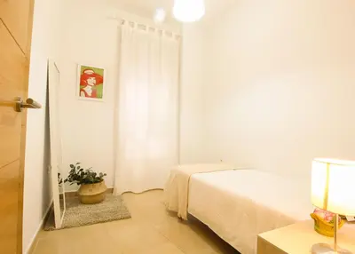 Cama o camas de una habitación en Apartamento en sevilla- San julian