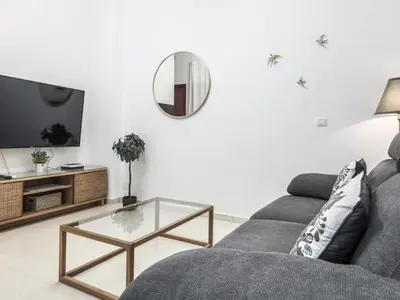 Una televisión o centro de entretenimiento en M. Auxiliadora acogedor y Tranquilo bajo