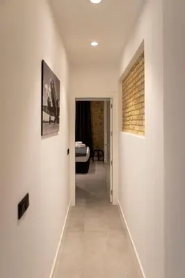 Cama o camas de una habitación en Alojamientos Carola Baños, 6