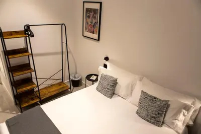Cama o camas de una habitación en Alojamientos Carola Baños, 6