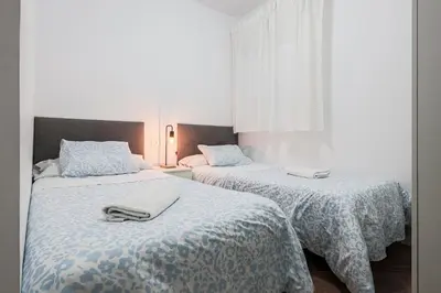 Cama o camas de una habitación en Algaba Huelva bajo