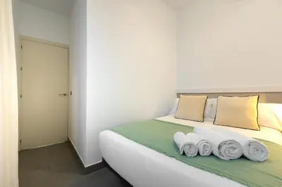 Cama o camas de una habitación en ISG Apartments Palacios Malaver 23
