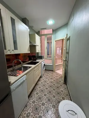Una cocina o zona de cocina en Makao Alameda 2 BR Apartment