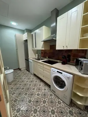 Una cocina o zona de cocina en Makao Alameda 2 BR Apartment