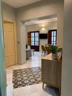 Una televisión o centro de entretenimiento en Makao Alameda 2 BR Apartment