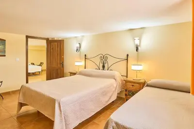 Cama o camas de una habitación en La Naranja Dulce CASA RURAL