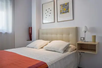 Cama o camas de una habitación en Duplex with terrace and pool in the center, WiFi, AC Matahacas dos dormitorios