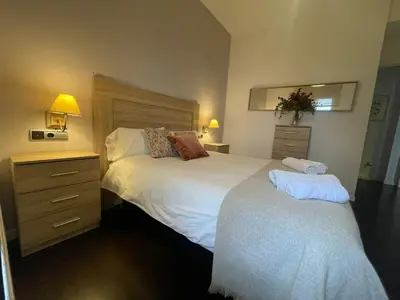 Cama o camas de una habitación en Casa de las Flores