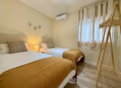 Cama o camas de una habitación en Nervion Apartments Sevilla