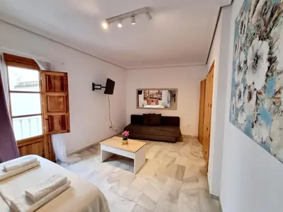 Cama o camas de una habitación en Estudio Alfalfa