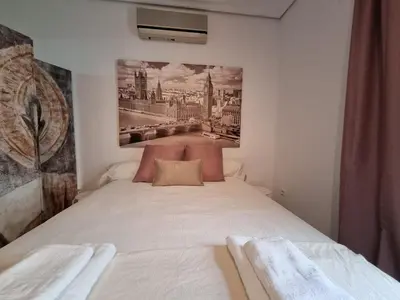 Cama o camas de una habitación en Estudio Alfalfa