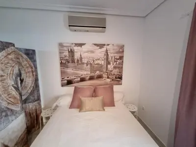 Cama o camas de una habitación en Estudio Alfalfa