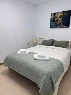 Cama o camas de una habitación en El HUERTO DE HELVIAS