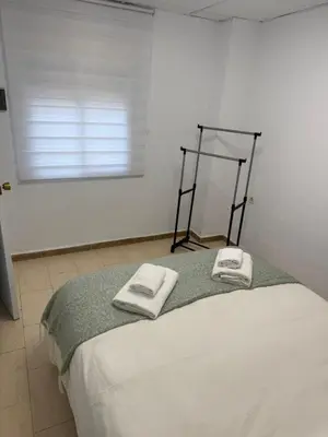 Cama o camas de una habitación en El HUERTO DE HELVIAS