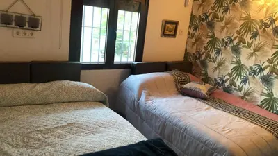 Cama o camas de una habitación en Casa Rural Herminia