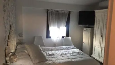 Cama o camas de una habitación en Casa Rural Herminia