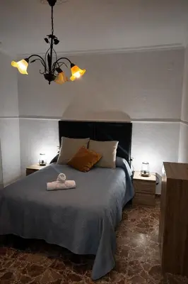 Cama o camas de una habitación en Apartamento EL LUCENTINO
